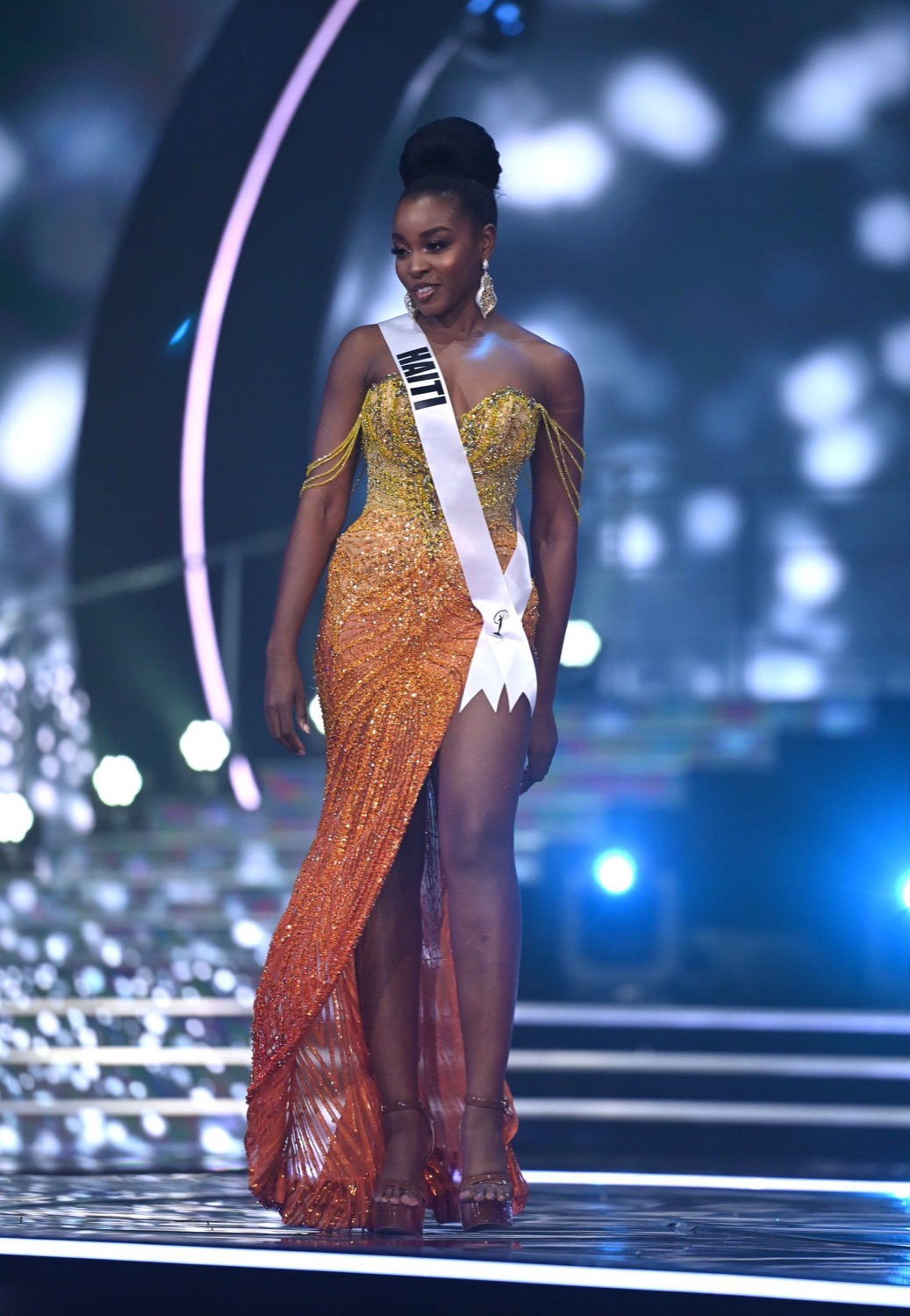 Pascale Belony on the pageant stage wearing the Haiti sash